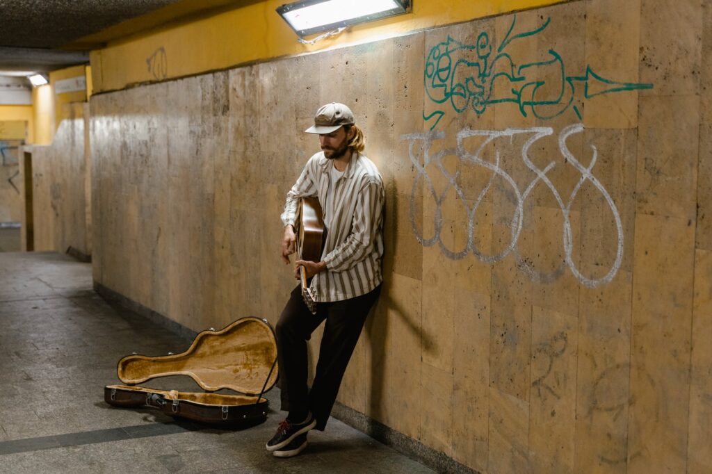 man playing acoustic guitar
